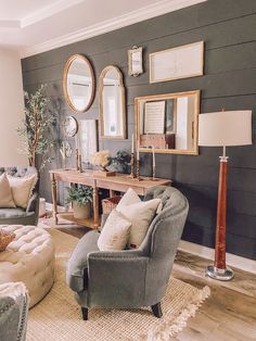 a living room filled with furniture and mirrors