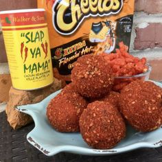 some food is sitting on a plate next to a can of cheetos