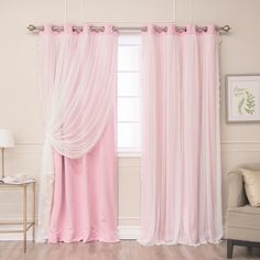 a pink curtain hanging in front of a window with sheer curtains on the top and bottom