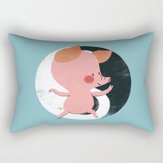 a blue rectangular pillow with a pink pig on it's back and an oval background