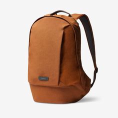 a brown backpack on a white background