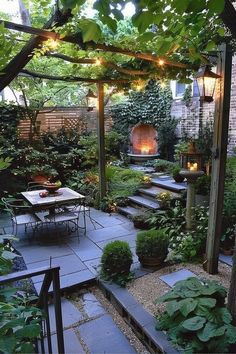 an outdoor patio with lots of plants and lights