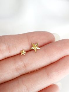 Tiny star stud earrings in two sizes, small and micro - faceted to give a little added sparkle.  Tumble polished to achieve a satin finish.  Sold as a SINGLE (choose options above). PAIRS available here: https://www.etsy.com/listing/686440218/MATERIALStarnish resistant rhodium silver filled/22k gold filled, sterling silver postsDIMENSIONS (LxW)micro: 4mm (just over 1/8")small: 7-8mm (1/4")◊ Matching star jewelry: https://www.etsy.com/shop/kindlingandco/search?search_query=star◊ More stud earring Celestial Earrings, Star Stud Earrings, Stud Earrings Silver, Tiny Star, Star Earrings Stud, Cross Ring, Jewelry Card, Star Jewelry, Star Studs