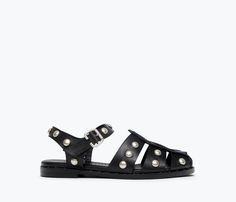 A tougher fisherman sandal. Handcrafted with our signature black calf, the SERA is classic with the caged upper and padded footbed but reimagined this season with cool understated studs. This style has a roomier fit. If you’re in between sizes or have a narrow foot, take a 1/2 size down. 100% Italian leather in black calf Padded leather footbed Studded welt leather sole with rubber layer for enhanced durability Adjustable strap with custom buckle Custom stud detail across upper leather Luxury Women's Fisherman Sandals For Spring, Luxury Closed Toe Classic Fisherman Sandals, Luxury Open Toe Fisherman Sandals, Luxury Fisherman Sandals For Spring, Luxury Casual Fisherman Sandals For Beach, Luxury Black Fisherman Sandals Open Heel, Affordable Open Toe Fisherman Sandals For Vacation, Luxury Casual Fisherman Sandals For Spring, Luxury Casual Women's Fisherman Sandals