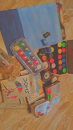 an assortment of children's art supplies including paint, pencils, and markers