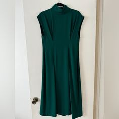 Never Worn, Beautiful Zara Woman Midi Dress, Perfect For Any Elevated Occasion With Heels Or Dressier Work Look, Emerald Green, Two Front Pleats With Flow, Sleeveless With Wider Shoulder Width And Mock Neck. Really Pretty! Size S, Flowy Bottom - I’m 5’8” And It Would Hit Me Mid-Calf Spring Classic High Neck Dress, Classic High Neck Spring Dresses, Sleeveless Green Midi Dress For Fall, Green Sleeveless Maxi Dress For Work, Green A-line Maxi Dress For Work, Green Fitted High Neck Maxi Dress, Fitted High Neck Green Maxi Dress, Zara Classic Workwear Dresses, Classic Fitted Zara Dress