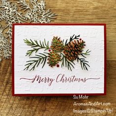 a christmas card with pine cones and snowflakes