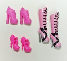 there is a pink doll with high heels and shoes