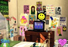 a bedroom with posters on the wall and a television