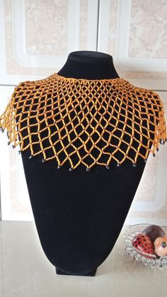 African Beaded wedding necklace, Zulu Cape necklace, Beaded shawl necklace, Christmas gift for her, Women jewelry, Bridesmaid giftThis beaded bib necklace is superbly crafted which can be worn with any outfit at different occasions and it will absolutely makes you stand out.Main color - gold.The necklace can be available in different colors.Wholesale available at a fair price,please contact me.For any clarification,please send me a convo or an e-mail.Thank you for visiting and happy shopping!!.. Elegant Polished Beads Bib Necklace Gift, Elegant Bib Necklace With Polished Beads For Gift, Elegant Bib Necklace With Polished Beads As Gift, Traditional Wedding Necklaces With Bead Caps, Traditional Wedding Necklace With Bead Caps, Gift Beaded Bib Necklace, Beaded Shawl, African Beads Necklace, Jewelry Making Business