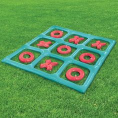 an inflatable toy on the grass with doughnuts and pretzels