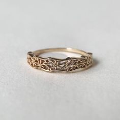 Vintage Filigree Wedding Band Stacking Ring 10k Solid Gold Antique Floral Wedding Ring Migraine Matching Band Anniversary Ring The word 'ring' has two meanings. Rings are one of the most widely celebrated types of jewelry all over the world. These awesome rings features Elegant and dainty Shape. The antique pattern make the ring so dainty and minimalist that you can wear it every day. A perfect gift for anniversaries, birthdays, and graduations, this piece is so cute and sophisticated that you would like to wear it every day. You can also gift these to your sorority sisters and best friends for a gift they are sure to adore! I T E M S P E C I F I C A T I O N S Metal : 10K Gold Hallmark : 10K The Ring is Approx.1.2mm (approx) angular shank. The Ring comes in 36 sizes: 4 US/CA Uk size - H In Filigree Wedding Band, Word Ring, Wedding Band Gold, Filigree Ring Gold, Antique Style Rings, Stacked Wedding Bands, Flower Rings, Stackable Rings Silver