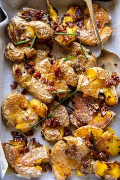 roasted potatoes with bacon and chives in a baking dish, ready to be eaten