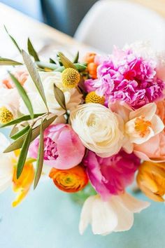 a bouquet of flowers sitting on top of a table