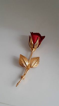 Signed Covani gold tone and red enamel rose brooch/pin. Excellent condition Vintage Red Lapel Pin As Gift, Vintage Red Lapel Pin For Gift, Red Vintage Lapel Pin As Gift, Red Vintage Lapel Pin For Gift, Formal Gold Brooch With Rose Design, Collectible Gold Flower Enamel Pin, Gold Flower Enamel Pin Gift, Gold Flower Enamel Pin For Gift, Gold Brooches For Valentine's Day