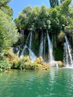 the water is crystal green and there are many waterfalls in the area that surround it