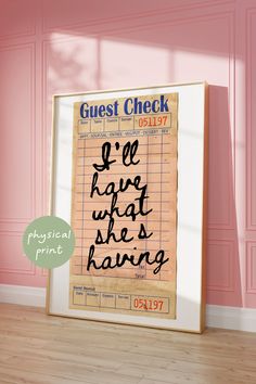 a poster with the words guest check written on it in front of a pink wall