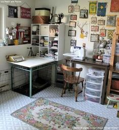 a room filled with lots of clutter and pictures on the wall above a desk