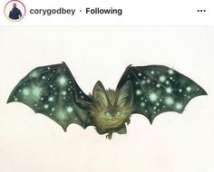 an image of a bat flying through the air with stars on it's wings