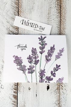 a card with some purple flowers on it