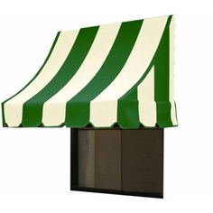 a green and white striped awning over a window