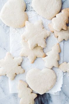 several cut out sugar cookies with white icing