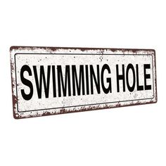 an old rusty swimming hole sign on a white background