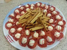 a plate full of snacks and crackers on a table