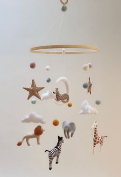 a mobile with animals and stars hanging from it