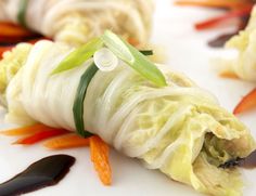 an assortment of food items on a white plate, including carrots and celery