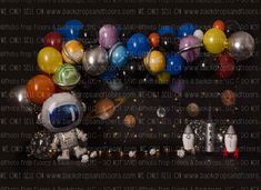 an assortment of balloons and space related objects