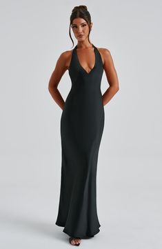 Feel like an angel in Halo, our silky soft maxi made in a luxurious satin with a light texture. With a plunge, halter neckline, this style ties at the back neck and is cut on the bias for a beautiful drape that skims over the figure. 



Colour: Black.

Premium non-stretch satin with light texture.

Fully lined.

Plunge, halter neckline.

Cut on the bias for a beautiful drape.

Ties at the back neck.

Invisible zipper fastening.

Maxi length.

 Size: XS, S, M, L, XL, XXL Chic Satin Finish Maxi Dress With Fitted Bodice, Chic Maxi Dress With Satin Finish And Fitted Bodice, Satin V-neck Halter Dress For Evening, Elegant V-neck Halter Dress, Elegant Backless Maxi Dress With Sweep Train, Evening Satin Maxi Dress With Ruched Back, Satin Maxi Dress With Ruched Back For Evening, Chic Satin Finish V-neck Evening Dress, Sleek Backless Evening Maxi Dress