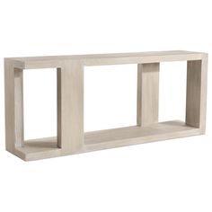 a white wooden shelf with three sections on each side and one section at the top