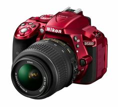 a red digital camera on a white background