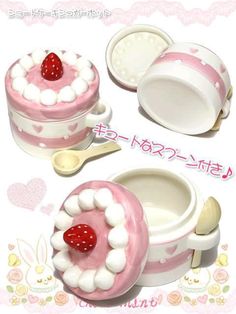 a pink and white cake with strawberries in it's center on a plate