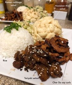 a white plate topped with meat and rice covered in seasoning next to broccoli