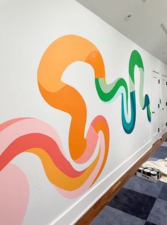 an office with colorful graphics on the wall