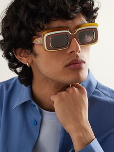 LOEWE Eyewear's collections with Paula's Ibiza always deliver playful accessories like these sunglasses. They're made from layered acetate with '70s-inspired frames and have gold-tone logos at the temples. Loewe Eyewear, Loewe Paula's Ibiza, Acetate Sunglasses, Outdoor Running, John Hardy, Stylish Watches, Sunglasses For Men, 70s Inspired, Loungewear Shorts