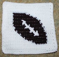 a crocheted square with an airplane on it