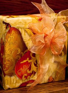 a close up of a wrapped present on a shelf