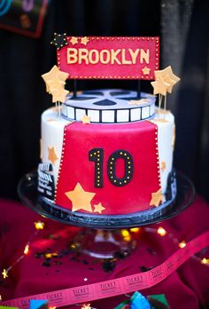 a red and white cake sitting on top of a table