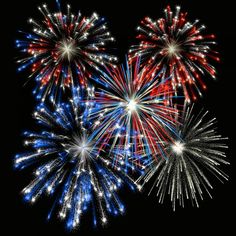 fireworks are lit up in the night sky with red, white and blue lights on them