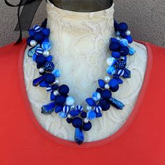 Blue and White Twisted Wire Statement Necklace is made with a variety of beads and pearls in various shapes and shades of Blue. The 7 Dangle Spikes are Titanium Quartz. Many of the beads are acrylic so the piece is virtually weightless and Nickle Free.  Beads and Pearls  18, 20 or 22 Inches in length with a Rhinestone Magnetic Clasp  Twisted Wire  Free Matching Dangle Earrings  Free US Shipping  Ships in 1 Day  Gift Wrapping Available This necklace was inspired by my favorite vintage Pearl Choke Blue Polished Bead Jewelry For Parties, Blue Polished Beads Jewelry For Party, Blue Polished Beads Party Jewelry, Blue Faceted Bead Necklace For Party, Blue Faceted Beads Necklace For Party, Blue Faceted Beaded Necklaces For Party, Elegant Blue Beaded Necklaces For Party, Blue Polished Beads Necklaces For Party, Blue Polished Beaded Necklaces For Parties