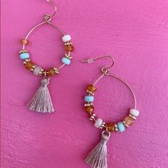 Elevate your summer style with our exquisite Coastal Rose Earrings, designed to bring a touch of coastal chic elegance to your look. These stunning statement earrings feature delicate pink beads and flowing fringe, perfect for any beach lover seeking a pop of color. Crafted with meticulous attention to detail, the Coastal Rose Earrings blend a radiant golden base with soft pink hues, capturing the essence of a beachy sunset. The pink beaded fringe sways gracefully, adding a playful yet sophistic Beaded Drop Earrings With Tassels For The Beach, Beaded Tassel Drop Earrings For Beach, Trendy Dangle Tassel Earrings For Summer, Trendy Summer Tassel Dangle Earrings, Spring Beach Tassel Drop Earrings, Summer Vacation Fringe Jewelry, Dangle Beaded Fringe Tassel Earrings For Beach, Beaded Fringe Drop Earrings For Beach, Beach Dangle Tassel Earrings With Fringe