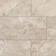 a tile floor with white marble tiles on the top and bottom half, in shades of beige