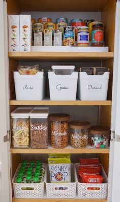 an organized pantry with lots of food and containers on the shelves, including cereals