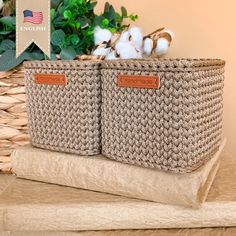 two woven baskets sitting on top of a table