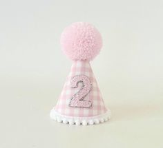 Pink Gingham party hat is made of pink gingham fabric from outside and pink felt from inside. Comes with handmade pink wool Pom, pompom trim and elastic band attached to it. Size is  H 13cm W 8cm Please make sure the size meets your expectations before ordering IMPORTANT: Please do not give it to the baby or kids to play with. It can cause choking due to small particles or decorations. So please take that granted. THANK YOU Kindley note: Make sure your address is correct during checkout to avoid Cute Pink Mini Hat For First Birthday, Cute Pink Mini Hats For Birthday, Pink Gingham Party, Gingham Party, First Birthday Pictures, 1st Birthday Cake Smash, Gingham Fashion, Pink Felt, 2nd Birthday Party