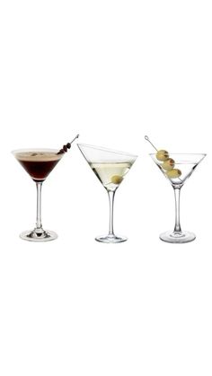 three martini glasses with olives in them on a white background, side by side