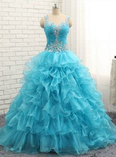 Garden-inspired and so very graceful, this Luxury Blue Crystal Ruffles Sweetheart Organza Quinceanera Dress by Kemedress is simply stunning. Floor length ball gown silhouette with straps sweetheart neckline, beading and sequins & beading embellishments with blue organza is well blend of Luxury Blue Crystal Ruffles Quinceanera Dress. Its Multiple layers of organza come together on the bodice creating a softer feeling, while the sequins & beading detailing adds a hint of shimmer and textural feel. This dress can come with a zipper closure with a lace-up option make its shape much delight. Princess Style Quinceanera Dress With Ruffles For Sweet 16, Princess Quinceanera Dress With Ruffles For Sweet 16, Sweet 16 Tulle Ball Gown With Ruffles, Sweet 16 Ball Gown With Ruffles And Fitted Bodice, Quinceanera Ball Gown With Ruffles And Sweetheart Neckline, Blue Princess Ball Gown With Sweetheart Neckline, Princess Blue Ball Gown With Sweetheart Neckline, Princess Style Blue Ball Gown With Sweetheart Neckline, Blue Floor-length Quinceanera Dress